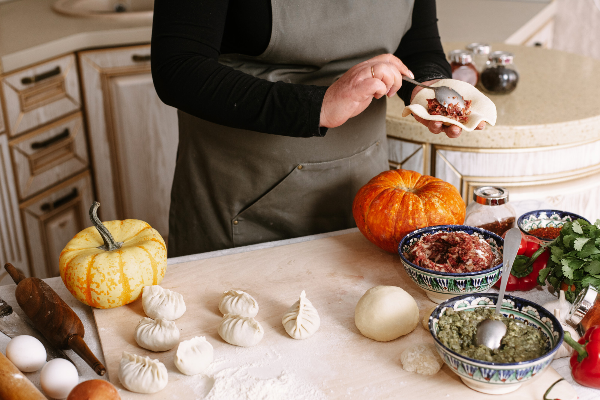 Chef arranging seasonal ingredients in studio